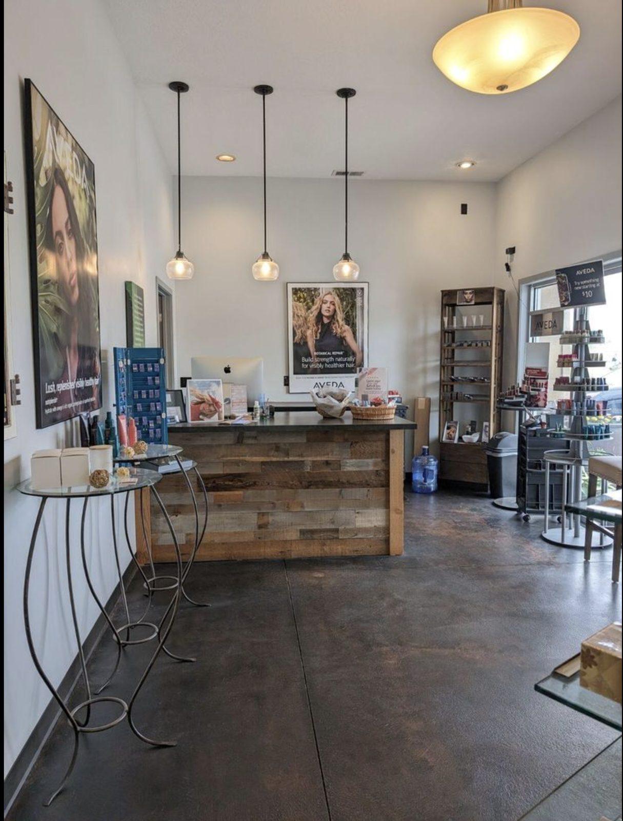 Synergy Salon reception with reclaimed wood desk